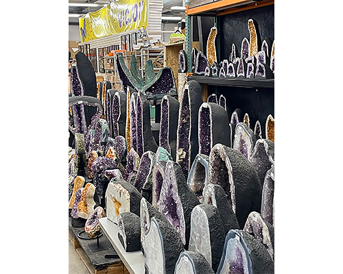Many Amethyst and Citrine Cathedrals are seen in this wholesale showroom at The Rock Warehouse's Tucson AZ warehouse purple orange crystals